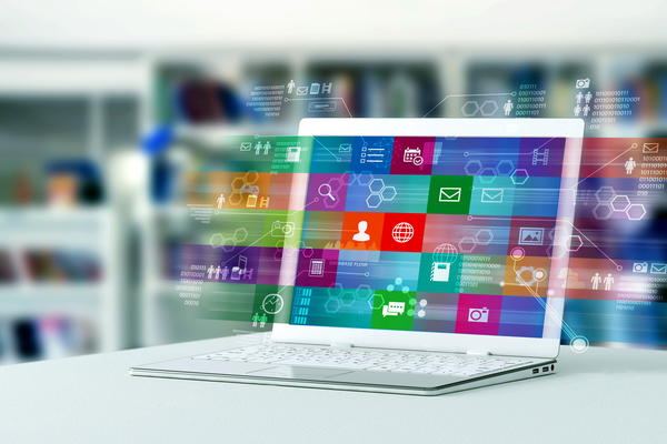 Laptop with holographic program icons on screen